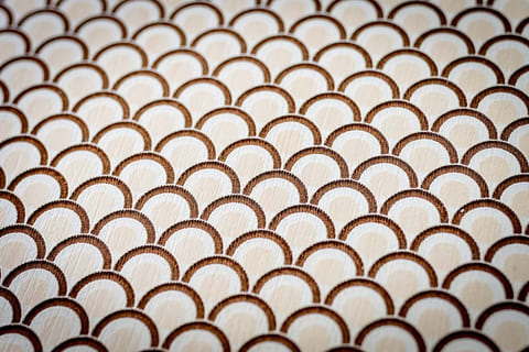 Detail of the microperforation on a wooden panel