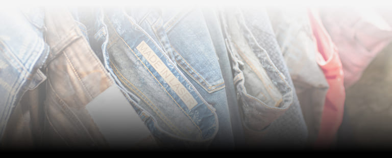 Jeans hanging on a rack after laser processing