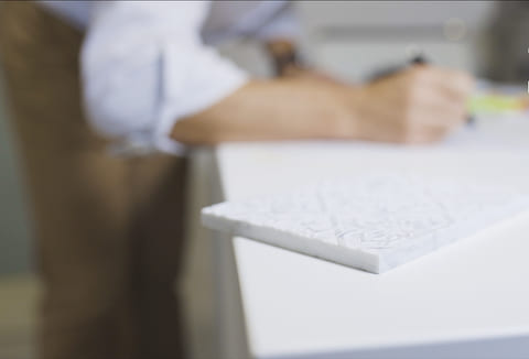 Designer planning a marble engraving project